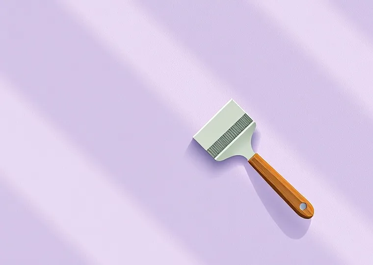 Application d'un enduit décoratif à la lisseuse sur un mur